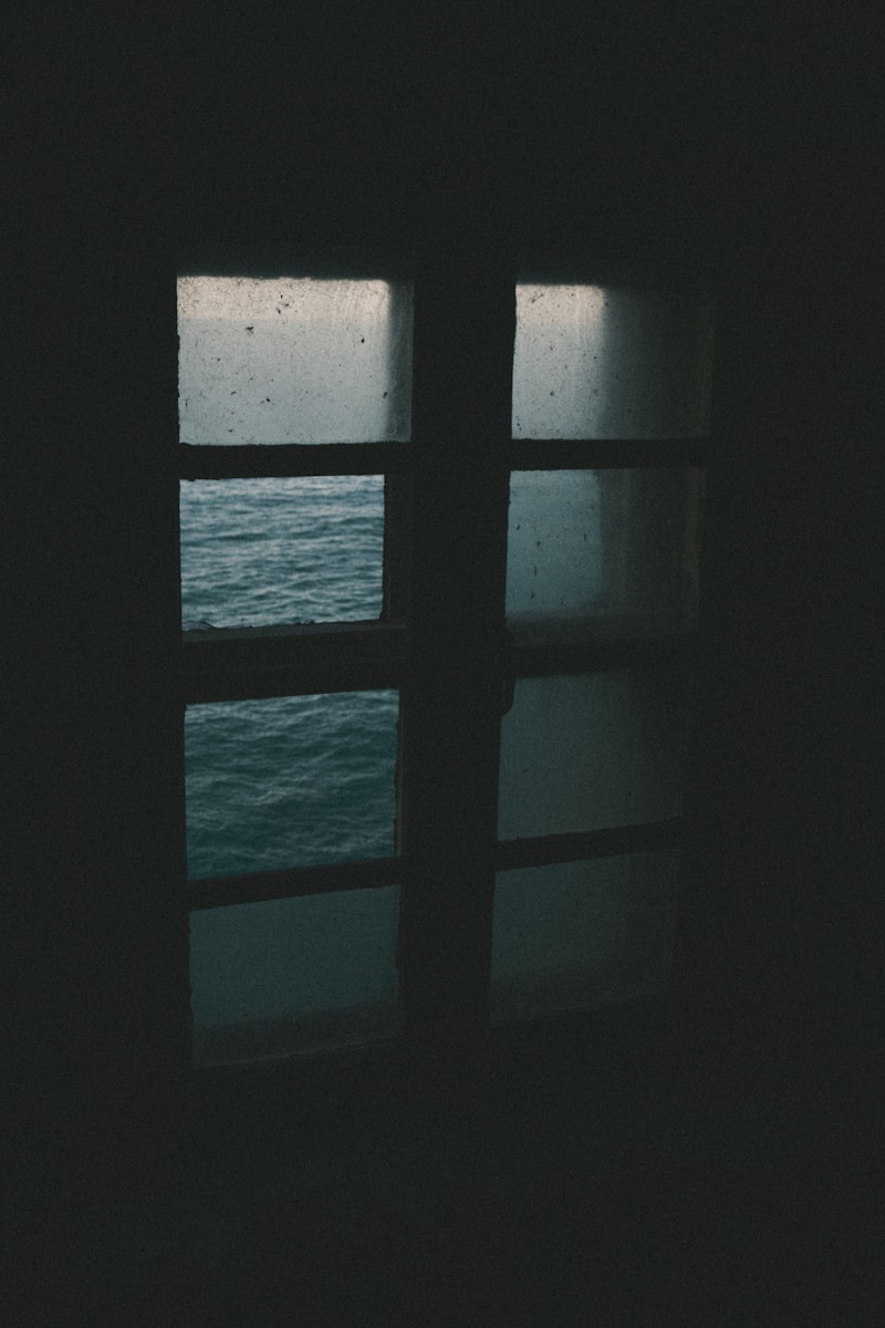 A window with a view of a body of water