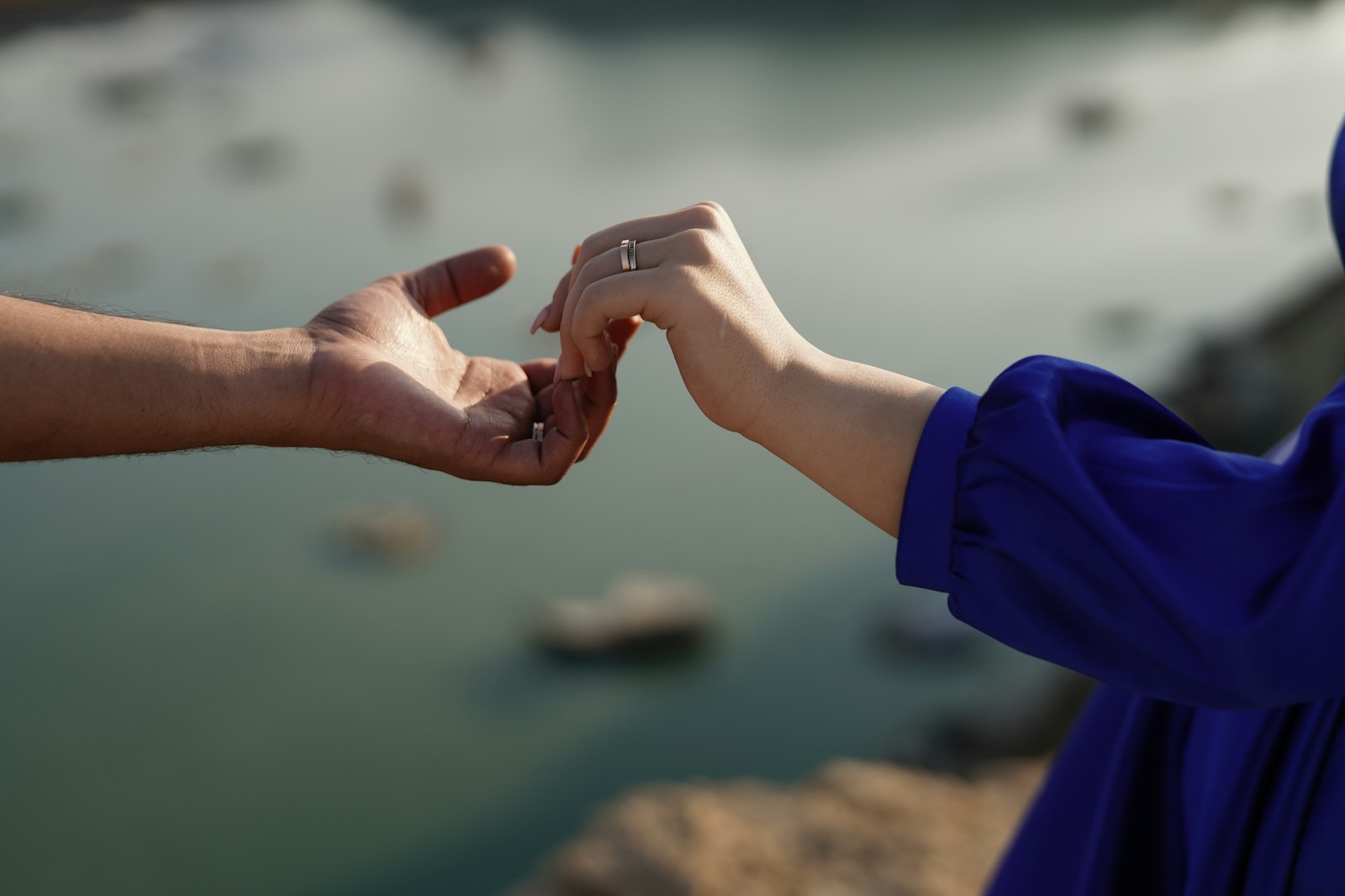 A couple of people that are holding hands